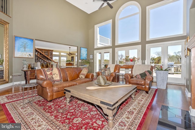 4083 Reels Mill Rd, Frederick, MD 21704 - living area featuring ceiling fan, a high ceiling, wood finished floors, baseboards, and stairway