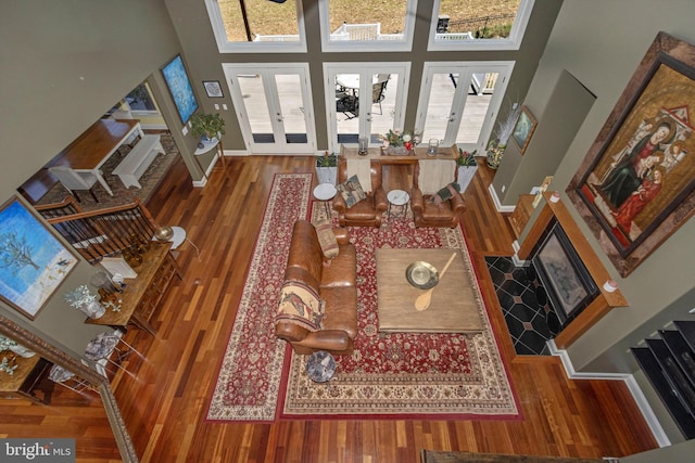 4083 Reels Mill Rd, Frederick, MD 21704 - living room featuring wood finished floors, french doors, plenty of natural light, and a towering ceiling