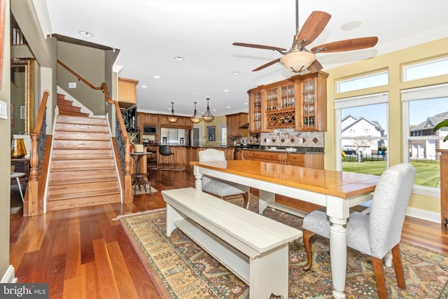 4083 Reels Mill Rd, Frederick, MD 21704 - dining room featuring ceiling fan, stairway, wood finished floors, ornamental molding, and recessed lighting