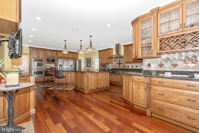 4083 Reels Mill Rd, Frederick, MD 21704 - kitchen with wall chimney range hood, stainless steel appliances, a center island, dark wood-type flooring, and tasteful backsplash