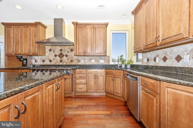 4083 Reels Mill Rd, Frederick, MD 21704 - kitchen featuring wall chimney range hood, appliances with stainless steel finishes, light wood finished floors, ornamental molding, and brown cabinetry