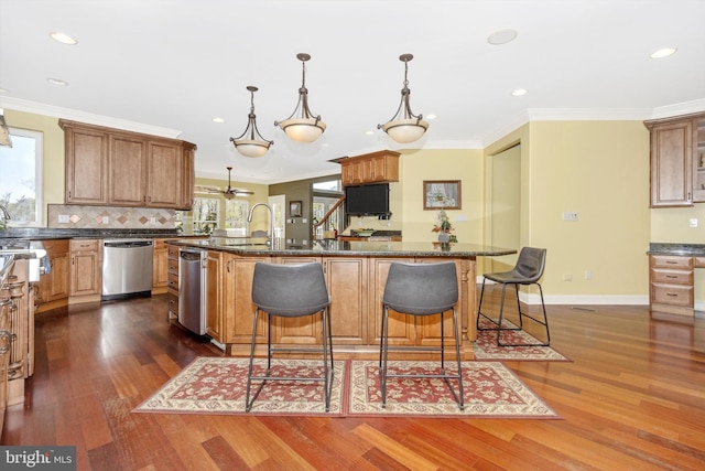 4083 Reels Mill Rd, Frederick, MD 21704 - kitchen with stainless steel dishwasher, a kitchen breakfast bar, dark wood-type flooring, recessed lighting, and a kitchen island with sink