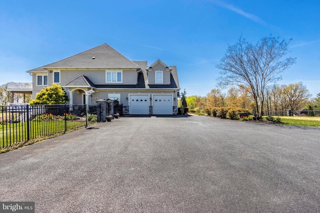 4083 Reels Mill Rd, Frederick, MD 21704 - view of front of property with fence, an attached garage, driveway, and stucco siding