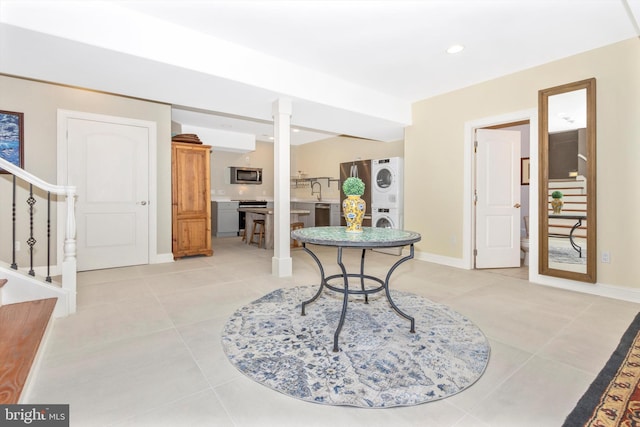 4083 Reels Mill Rd, Frederick, MD 21704 - foyer with stacked washer / dryer, stairs, light tile patterned flooring, baseboards, and recessed lighting