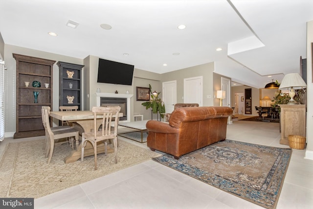 4083 Reels Mill Rd, Frederick, MD 21704 - living area with a glass covered fireplace, tile patterned flooring, and recessed lighting