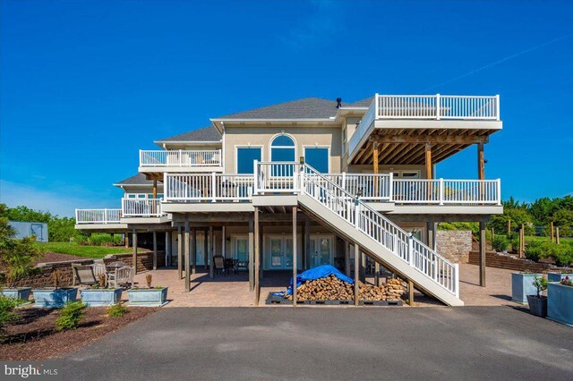 4083 Reels Mill Rd, Frederick, MD 21704 - rear view of property featuring a deck, a patio area, stairs, and a shingled roof