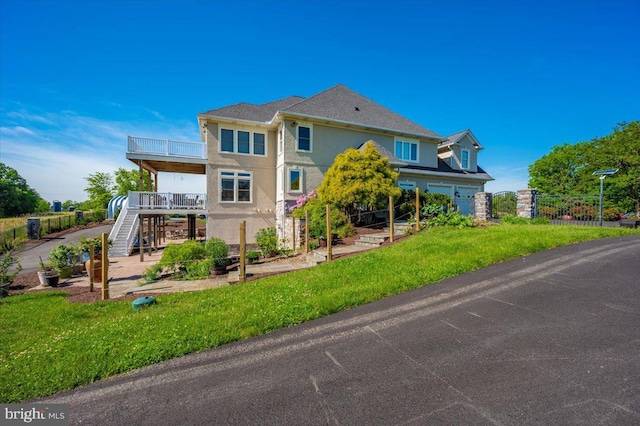 4083 Reels Mill Rd, Frederick, MD 21704 - view of front facade featuring stucco siding, stairway, a garage, and a balcony