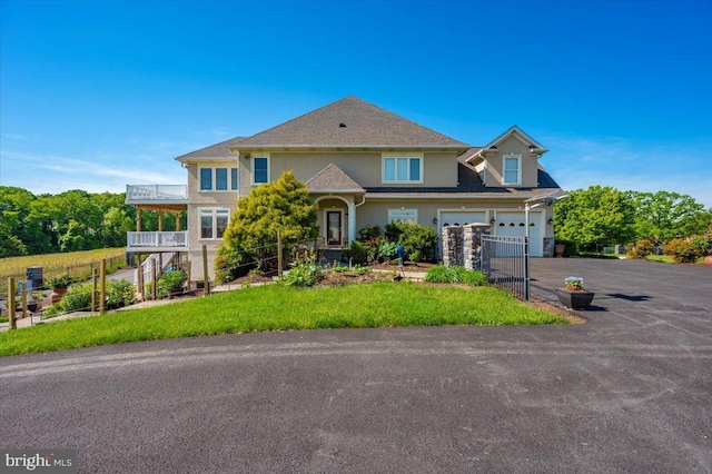 4083 Reels Mill Rd, Frederick, MD 21704 - traditional home featuring an attached garage, driveway, and stucco siding