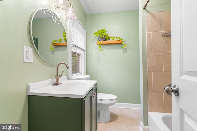 bathroom with tile patterned floors, vanity, baseboards, and toilet