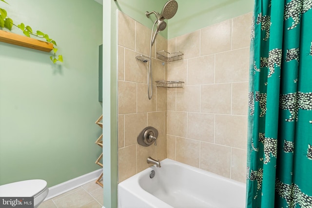 full bath featuring shower / bath combo, tile patterned flooring, baseboards, and toilet