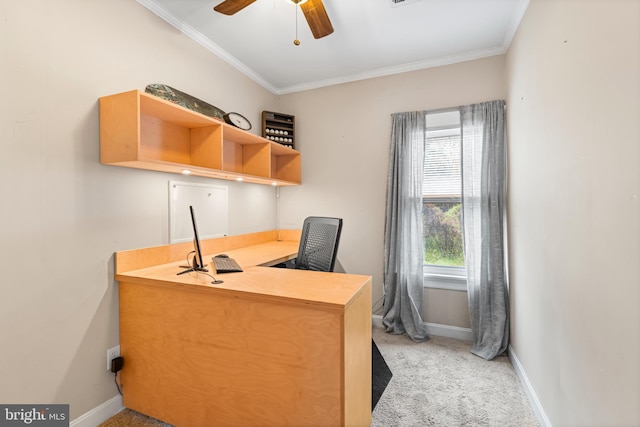 office featuring light colored carpet, baseboards, crown molding, and ceiling fan