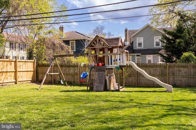 view of jungle gym featuring a fenced backyard and a lawn