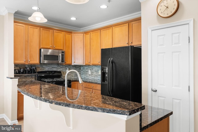 kitchen with dark stone counters, backsplash, black appliances, and crown molding