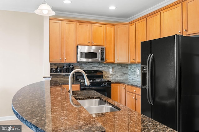 kitchen with decorative backsplash, dark stone counters, a sink, and black appliances