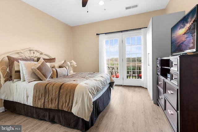 bedroom featuring access to exterior, light wood finished floors, ceiling fan, and visible vents