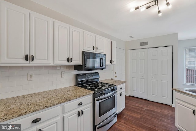 11620 Myrtle Oak Ct, Waldorf, MD 20601 - kitchen featuring stainless steel gas stove, black microwave, tasteful backsplash, and white cabinetry