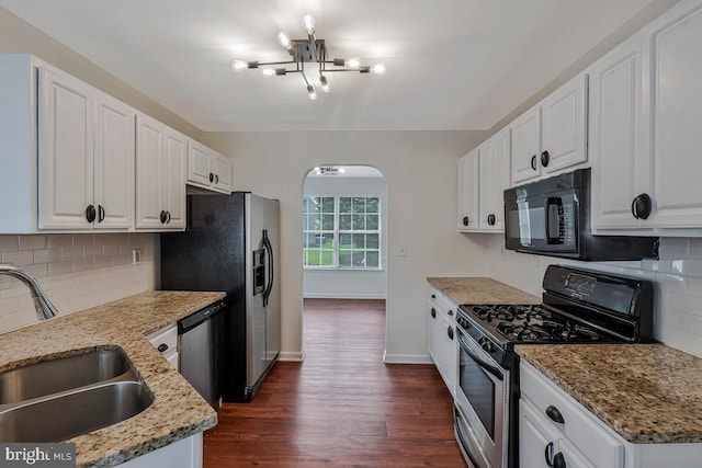 11620 Myrtle Oak Ct, Waldorf, MD 20601 - kitchen with appliances with stainless steel finishes, a sink, a chandelier, arched walkways, and dark wood finished floors