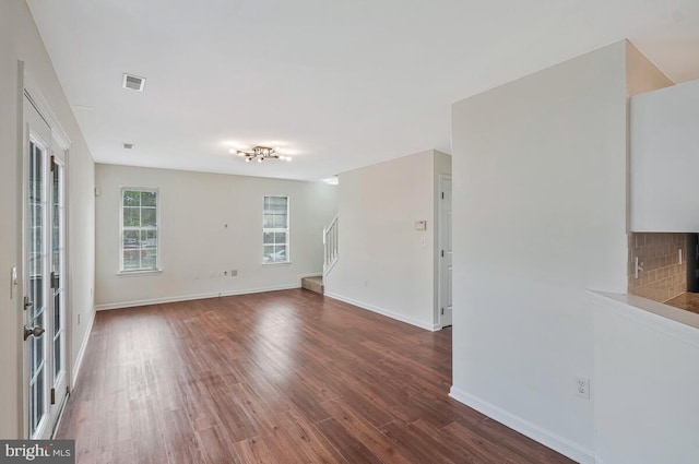 11620 Myrtle Oak Ct, Waldorf, MD 20601 - empty room featuring wood finished floors, stairway, and baseboards