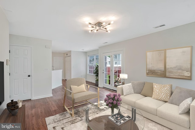11620 Myrtle Oak Ct, Waldorf, MD 20601 - living area with wood finished floors, baseboards, and a chandelier