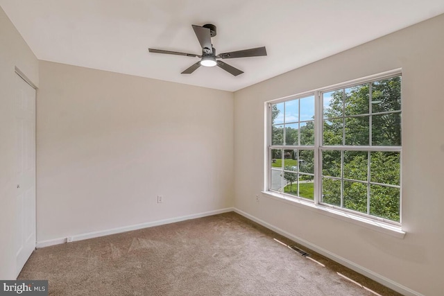 11620 Myrtle Oak Ct, Waldorf, MD 20601 - empty room with healthy amount of natural light, carpet flooring, baseboards, and a ceiling fan
