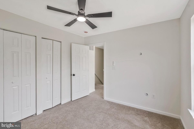 11620 Myrtle Oak Ct, Waldorf, MD 20601 - unfurnished bedroom with carpet floors, baseboards, ceiling fan, and two closets