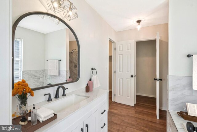11620 Myrtle Oak Ct, Waldorf, MD 20601 - full bathroom with vanity, wood finished floors, and a tub