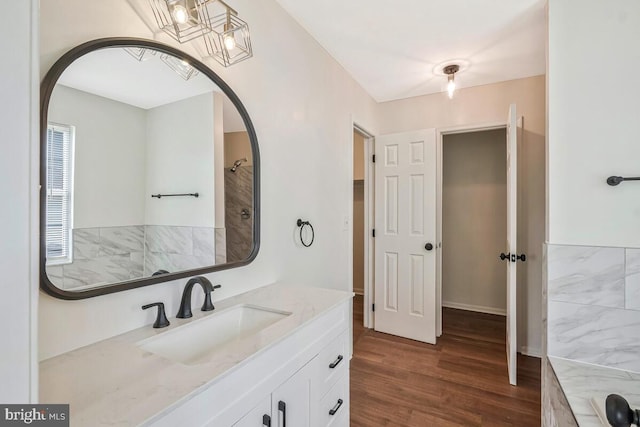 11620 Myrtle Oak Ct, Waldorf, MD 20601 - bathroom with wood finished floors, vanity, and a chandelier