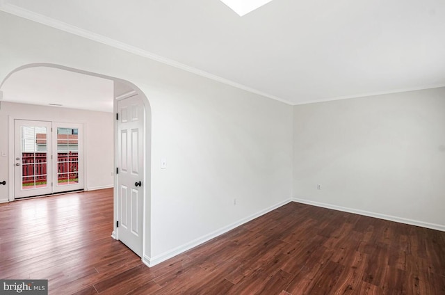 11620 Myrtle Oak Ct, Waldorf, MD 20601 - unfurnished room featuring wood finished floors, arched walkways, baseboards, and crown molding
