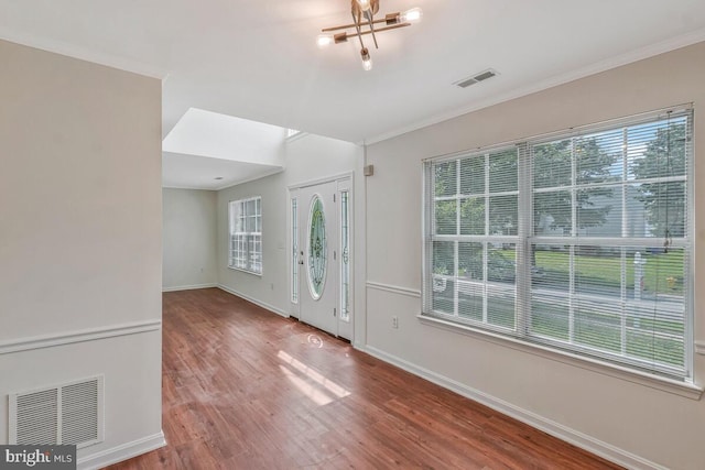 11620 Myrtle Oak Ct, Waldorf, MD 20601 - foyer entrance with healthy amount of natural light, wood finished floors, crown molding, and baseboards