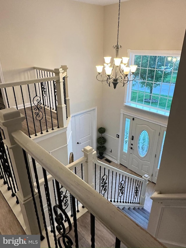 175 Barracuda Rd, Manahawkin, NJ 08050 - foyer entrance featuring a chandelier, a towering ceiling, and wood finished floors