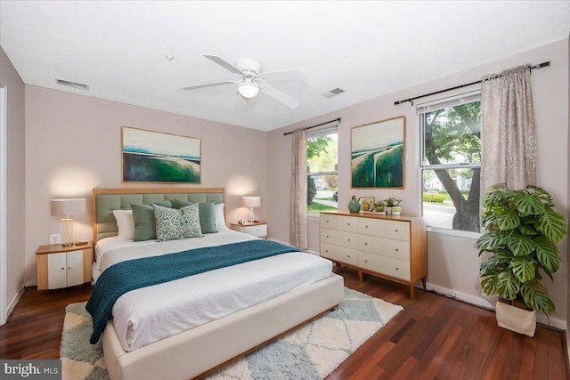 bedroom with baseboards, visible vents, wood finished floors, and a ceiling fan