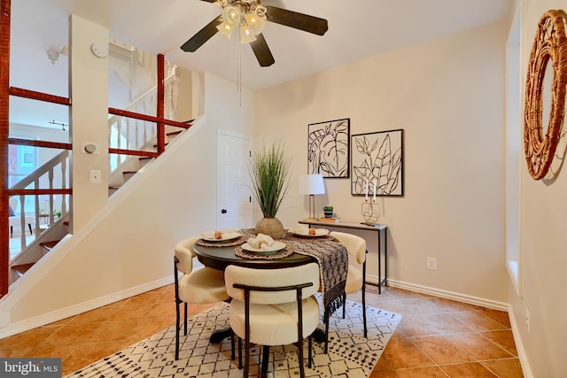 806 W 35th St, Baltimore, MD 21211 - dining room featuring a ceiling fan, baseboards, and stairway
