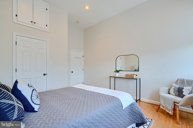 806 W 35th St, Baltimore, MD 21211 - bedroom featuring light wood finished floors, baseboards, a towering ceiling, and recessed lighting