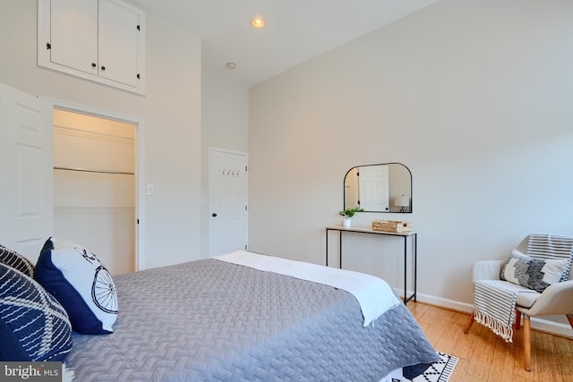 806 W 35th St, Baltimore, MD 21211 - bedroom featuring light wood-type flooring, baseboards, a high ceiling, and recessed lighting