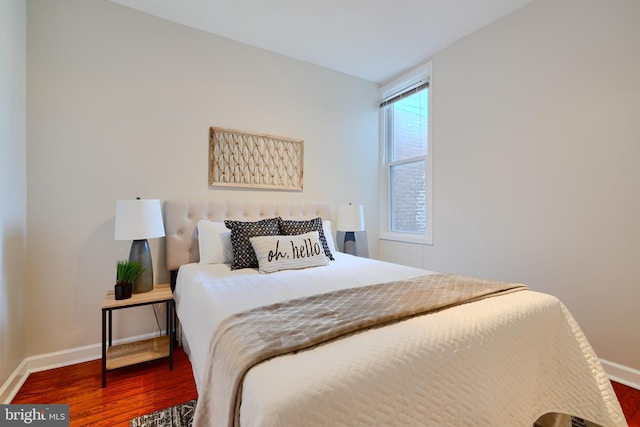 806 W 35th St, Baltimore, MD 21211 - bedroom featuring wood finished floors and baseboards