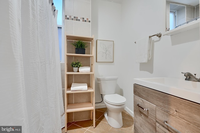 806 W 35th St, Baltimore, MD 21211 - bathroom with tile patterned floors, vanity, and toilet