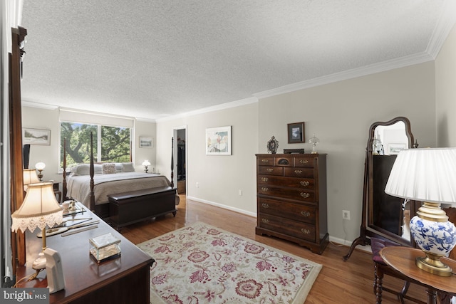1515 S Arlington Ridge Rd Unit 402, Arlington, VA 22202 - bedroom featuring baseboards, ornamental molding, a textured ceiling, and wood finished floors