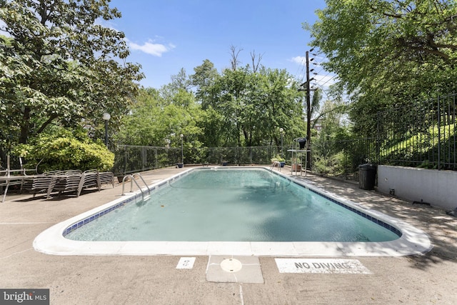 1515 S Arlington Ridge Rd Unit 402, Arlington, VA 22202 - view of swimming pool featuring fence, a patio area, and a fenced in pool