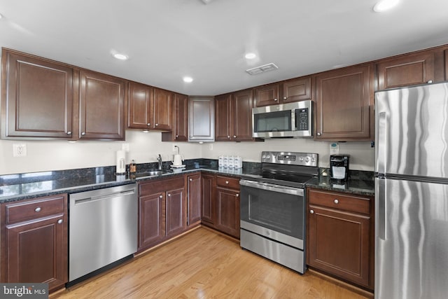1515 S Arlington Ridge Rd Unit 402, Arlington, VA 22202 - kitchen featuring visible vents, appliances with stainless steel finishes, a sink, recessed lighting, and light wood-style flooring