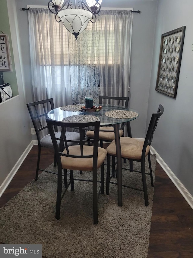 2027 Anchor St, Philadelphia, PA 19124 - dining room with wood finished floors, an inviting chandelier, and baseboards