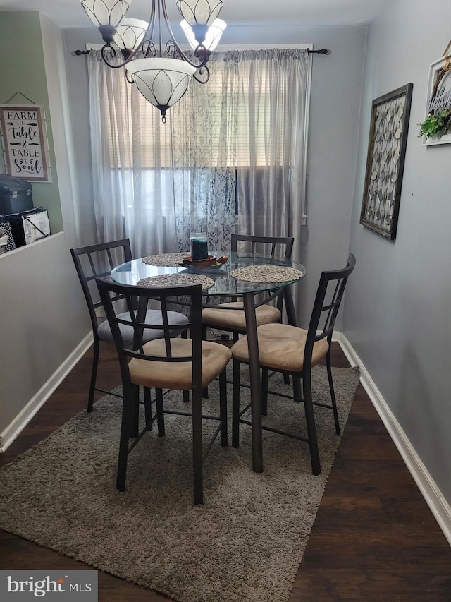 2027 Anchor St, Philadelphia, PA 19124 - dining room featuring wood finished floors, an inviting chandelier, and baseboards