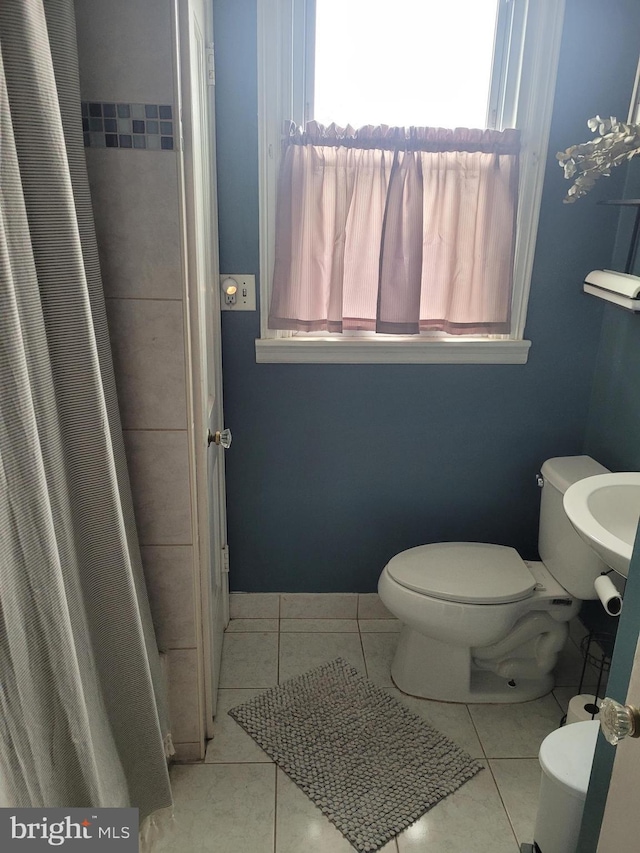 2027 Anchor St, Philadelphia, PA 19124 - full bath featuring toilet, a shower with shower curtain, and tile patterned flooring