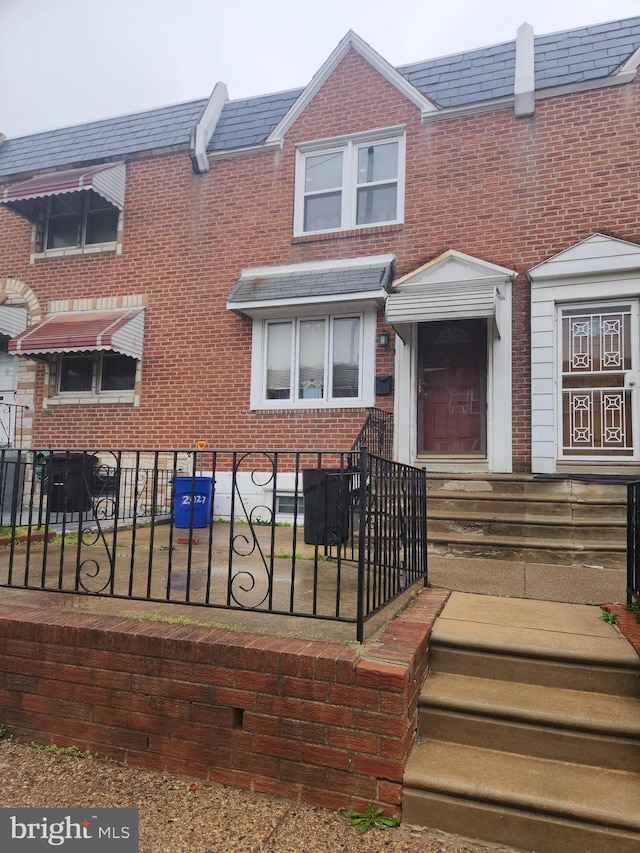 2027 Anchor St, Philadelphia, PA 19124 - view of front of home featuring brick siding and a fenced front yard