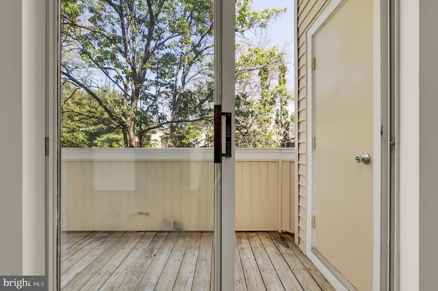 doorway to outside with light wood-type flooring