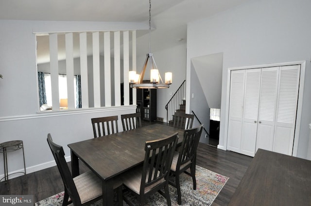 dining area featuring baseboards, an inviting chandelier, dark wood-type flooring, and stairway