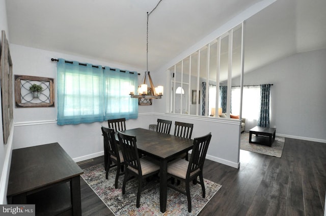 dining room with vaulted ceiling, baseboards, a chandelier, and dark wood finished floors