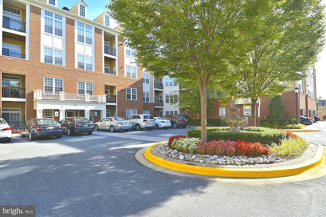 701 Fallsgrove Dr Unit 314, Rockville, MD 20850 - view of apartment building / complex featuring uncovered parking