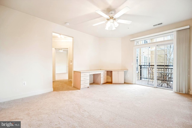 701 Fallsgrove Dr Unit 314, Rockville, MD 20850 - unfurnished bedroom with access to exterior, light colored carpet, and built in desk