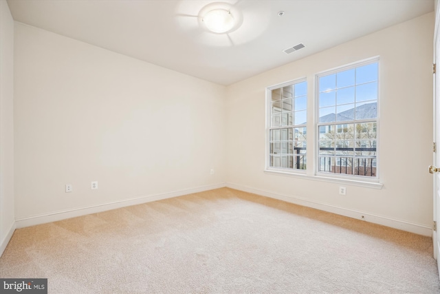 701 Fallsgrove Dr Unit 314, Rockville, MD 20850 - spare room featuring light colored carpet and baseboards