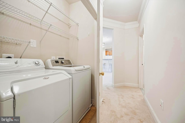 701 Fallsgrove Dr Unit 314, Rockville, MD 20850 - washroom featuring washer and dryer, light carpet, and crown molding